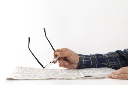 Man hands with reading newspaperの写真素材
