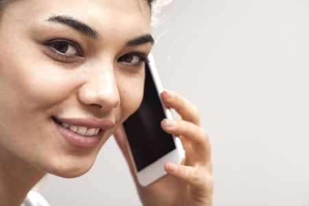 Portrait of woman talking mobile phone