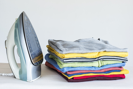 Ironing clothes on ironing boardの写真素材