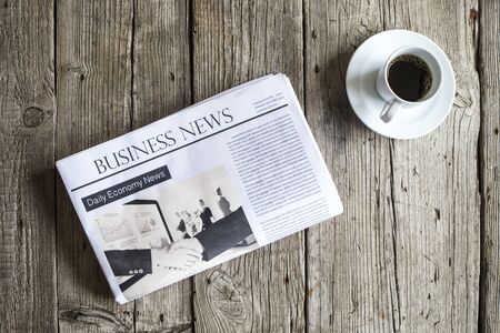 Newspaper on wooden tableの写真素材