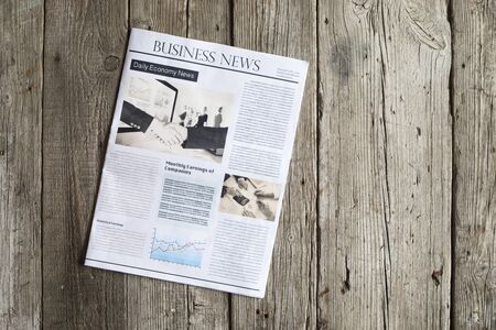 Newspaper on wooden tableの写真素材