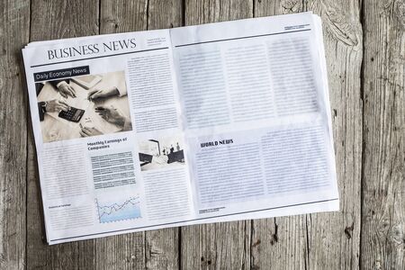 Newspaper on wooden tableの写真素材