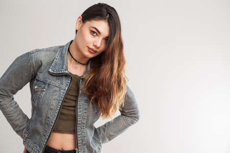 Young woman on gray backgroundの写真素材