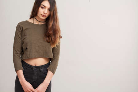 Young woman on gray backgroundの写真素材