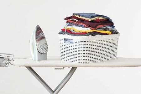 ?roning clothes on ironing board