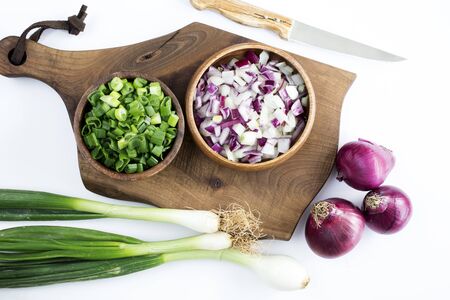 Chopped onions on chopping board