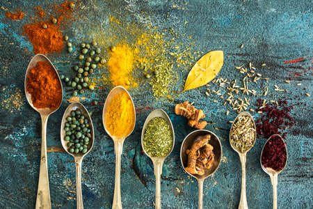 Spices and herbs on wooden backgroundの写真素材