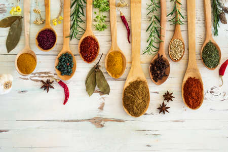 Spices and herbs on wooden backgroundの写真素材