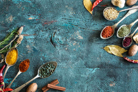 Spices and herbs on wooden backgroundの写真素材