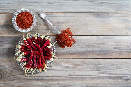 Dried red chili pepper on wooden background