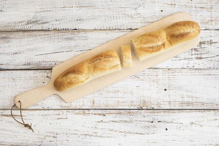 Freshly baked bread on wooden tableの写真素材
