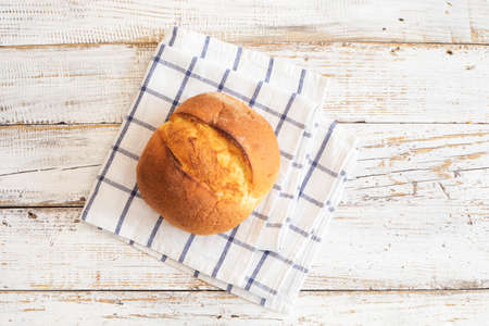 Freshly baked bread on wooden table