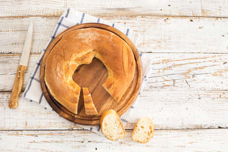 Freshly baked bread on wooden tableの写真素材