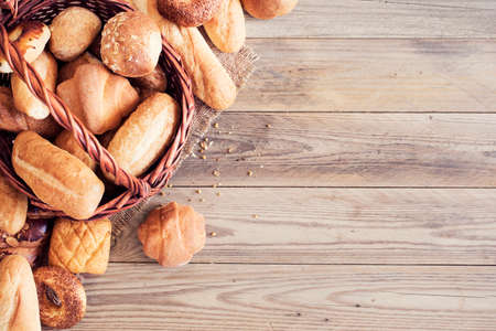 Freshly baked bread on wooden tableの写真素材