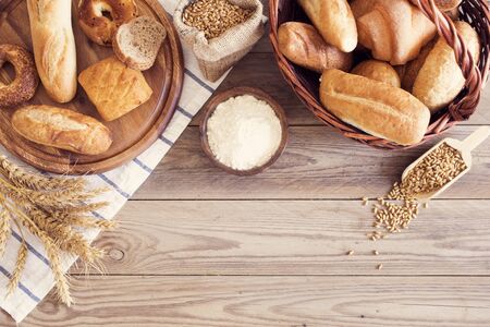Freshly baked bread on wooden tableの写真素材