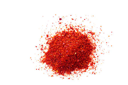 Red chili pepper powder on white backgroundの写真素材
