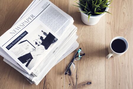 Newspaper on wooden tableの写真素材