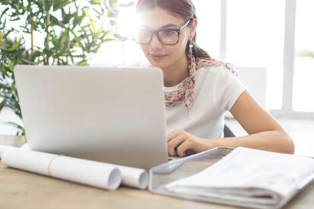 Woman using laptop while working