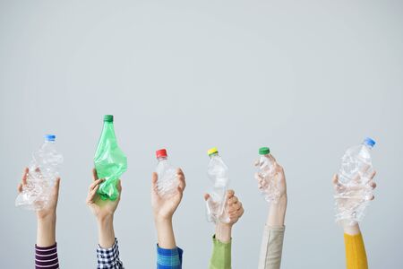 Hands holding plastic bottle