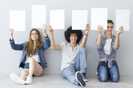 Young people holding banners