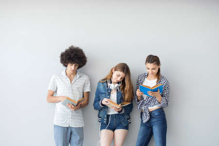 Young people reading booksの写真素材