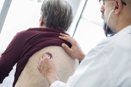 Senior man during medical examinationの写真素材