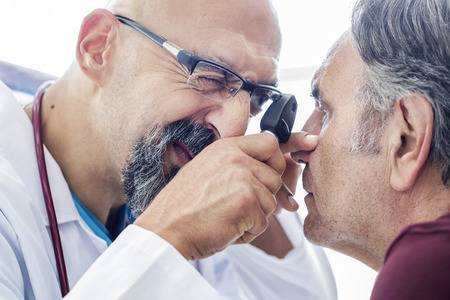 Elderly man examined by an ophthalmologistの写真素材