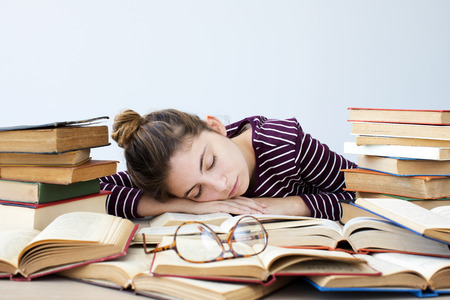 Student falls asleep while studyingの写真素材