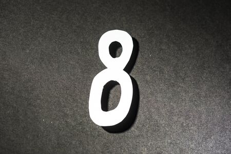 Number eight on the grey backgroundの写真素材