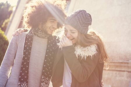 Young couple having fun, bright outsideの写真素材