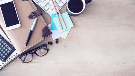 Working table on wooden backgroundの写真素材