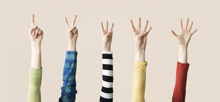 Raised up hands and fingers showing numericalの写真素材
