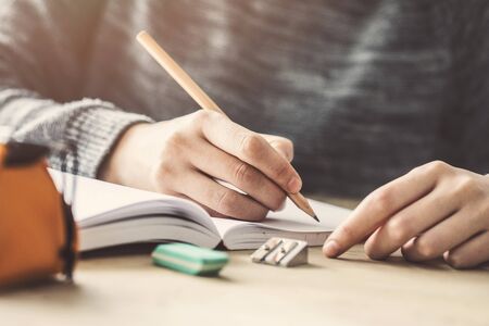 Young female student in examinationの写真素材