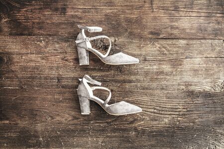 Suede female shoes on wooden backgroundの写真素材
