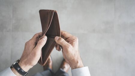 Man hand holding empty wallet