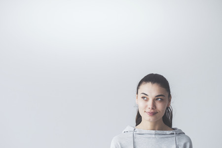 Portrait of young woman looking upの写真素材