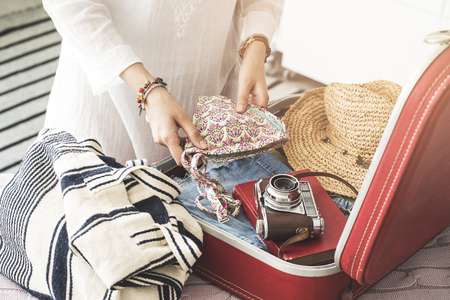 Woman preparing summer luggageの写真素材