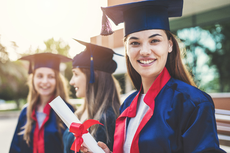 Young female students graduating from universityの写真素材
