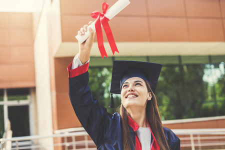 Young female student graduating from universityの写真素材