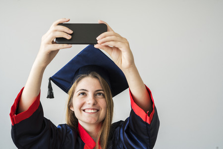 Young female student graduating from university