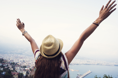 Female arms raised on Alanya Turkey backgroundの写真素材