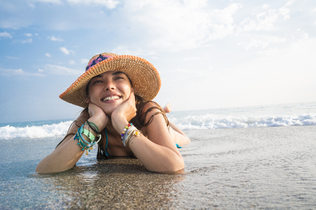 Beautiful young woman on beachの写真素材