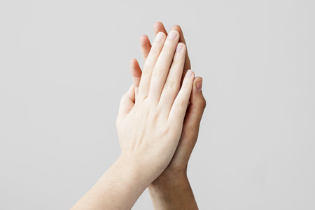 High five gesture on gray backgroundの写真素材