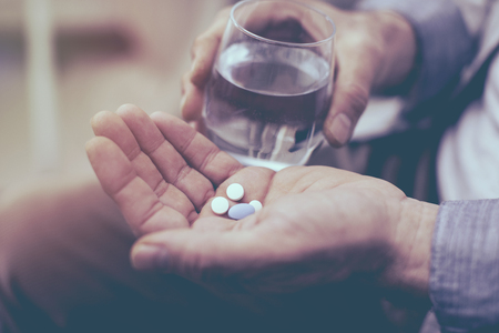 Old man taking a pillの写真素材