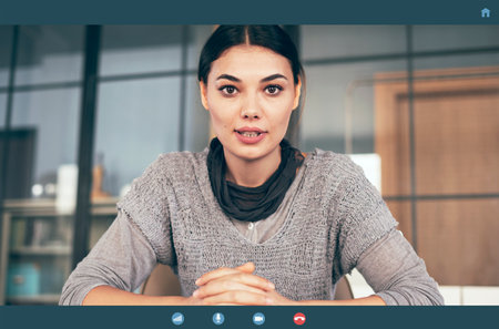 Talking by video call on computerの写真素材
