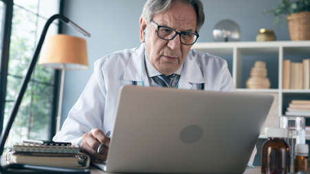 Talking by video call on computerの写真素材