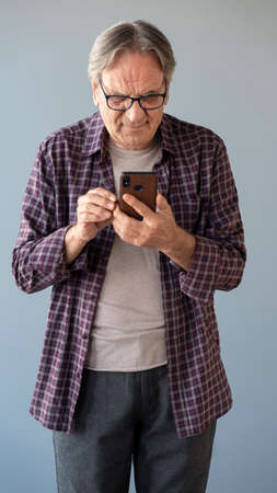 Man typing on mobile smartphoneの写真素材