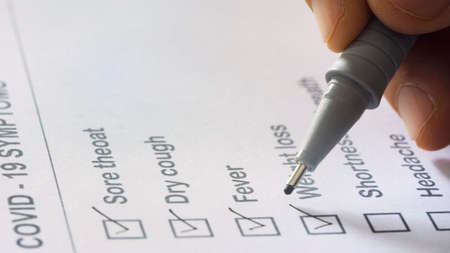 Doctor filling medicare health history checklistの写真素材