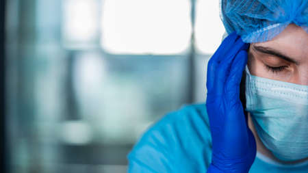 Portrait of stressed tired healthcare worker