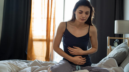 Woman suffering from stomach ache